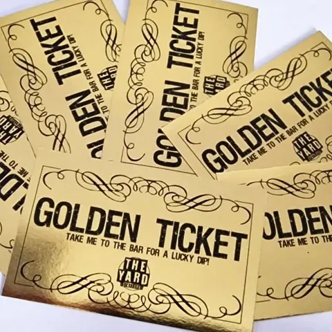 Golden promotional tickets printed with black lettering for The Yard