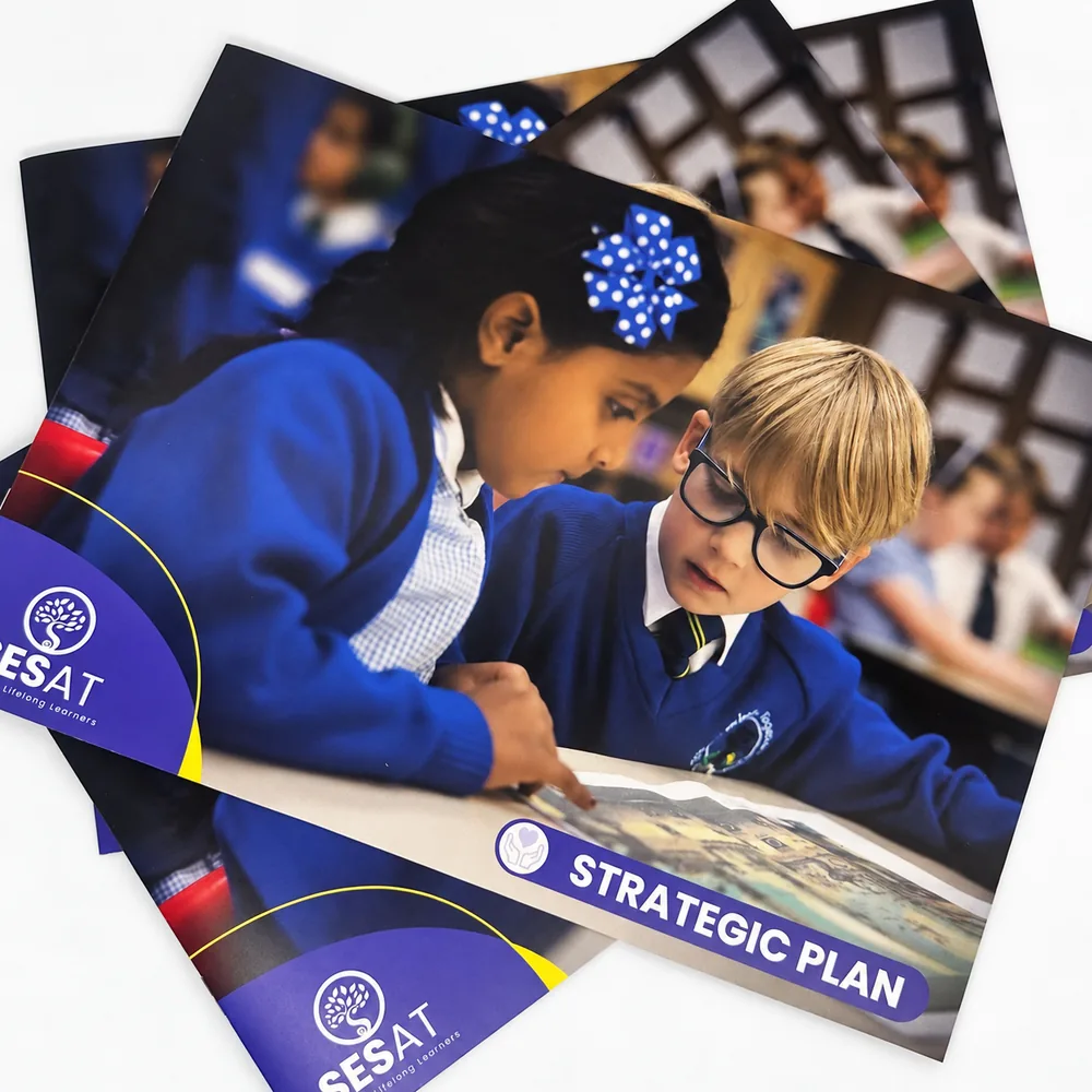 Printed school strategic plan booklets featuring pupils