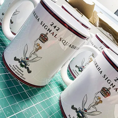 Personalised mugs featuring the 242 Gurkha Signal Squadron crest and names