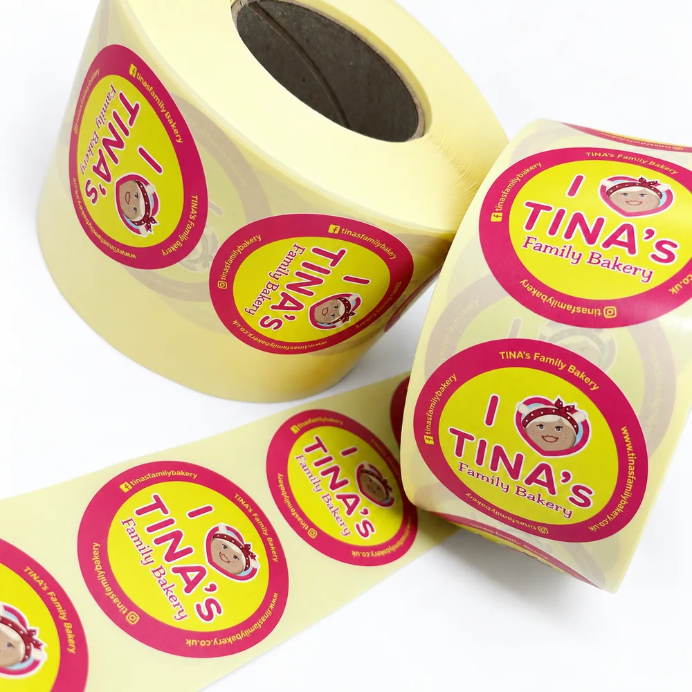 Rolls of round Tina’s Family Bakery labels