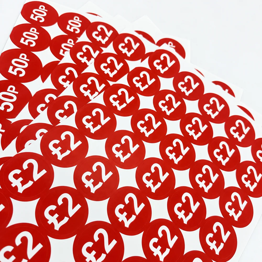 Sheets of red 50p and £2 price stickers