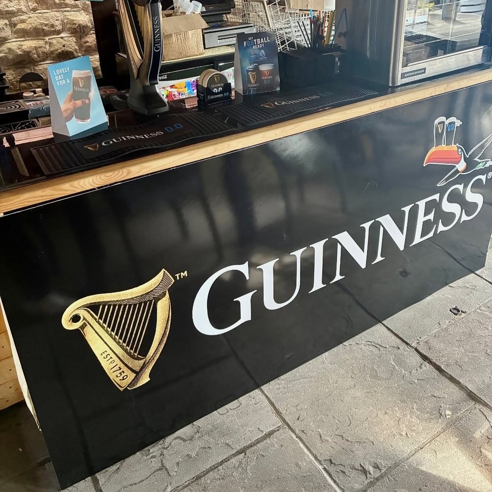 Large printed bar front signage panel produced by Vivid Design & Print Co in Stafford