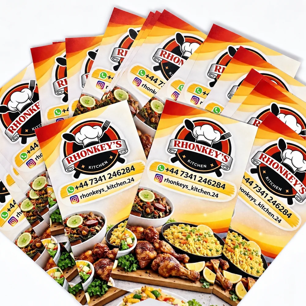 Printed Rhonkey’s Kitchen promotional cards arranged in a fan