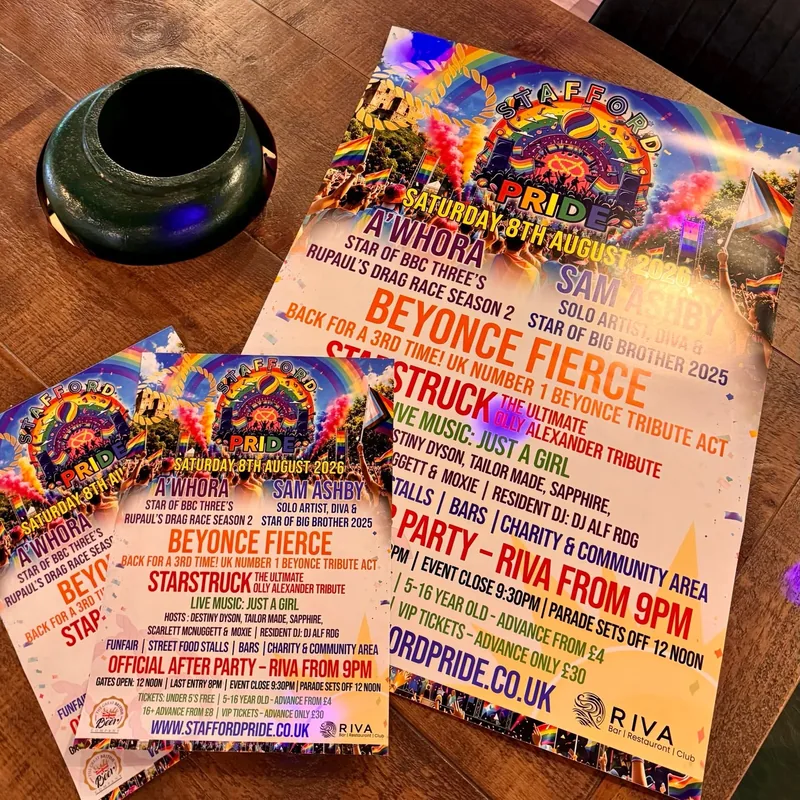 Colourful Stafford Pride flyers beside a matching poster